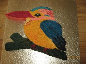 Iced cake made in the shape and colours of a Woodland Kingsfisher bird